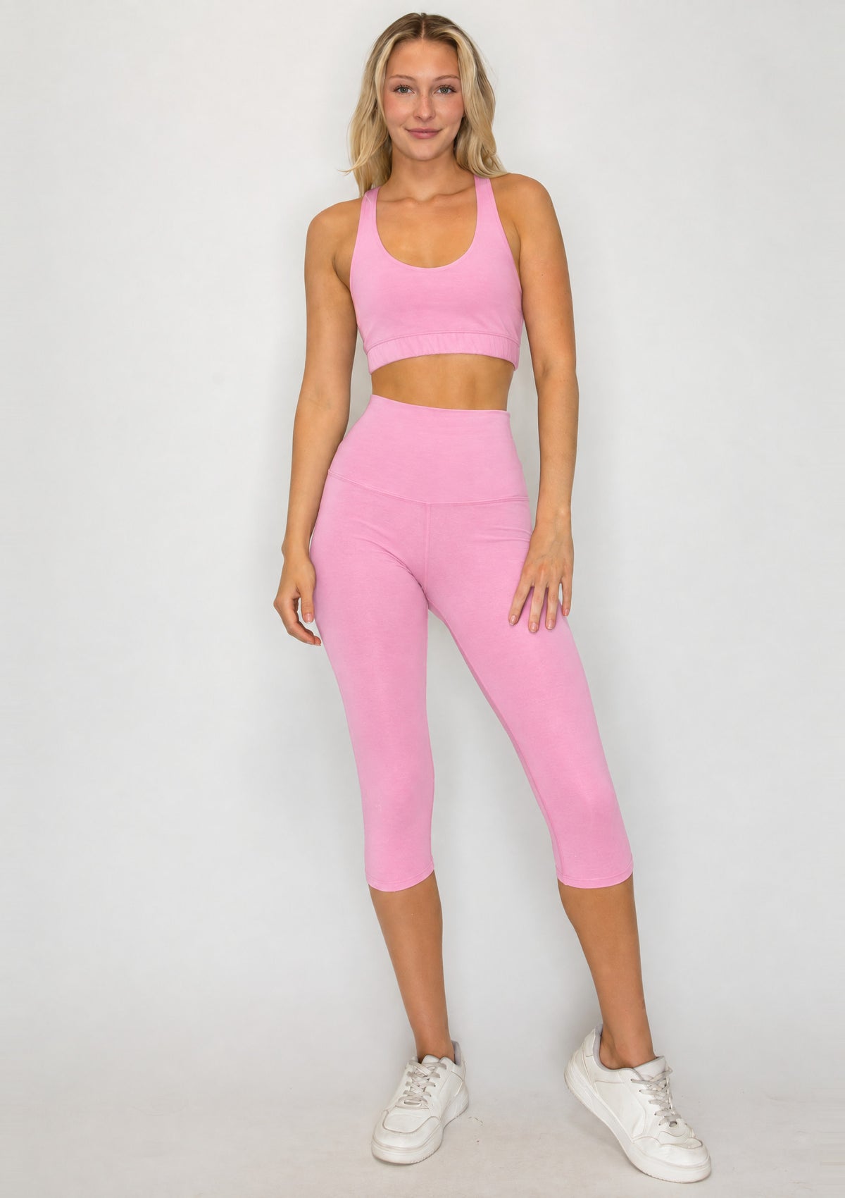 Full-length front view of PureFlex Organic Cotton Capri Leggings in Reef Rose